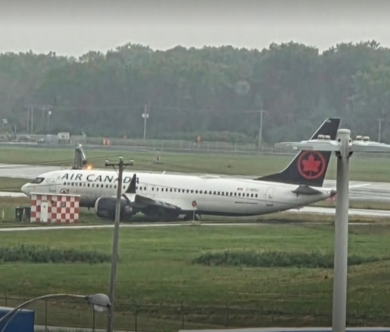 Air Canada Boeing 737 MAX 8 resting on the grass after exiting the runway at Montreal-Trudeau Airport